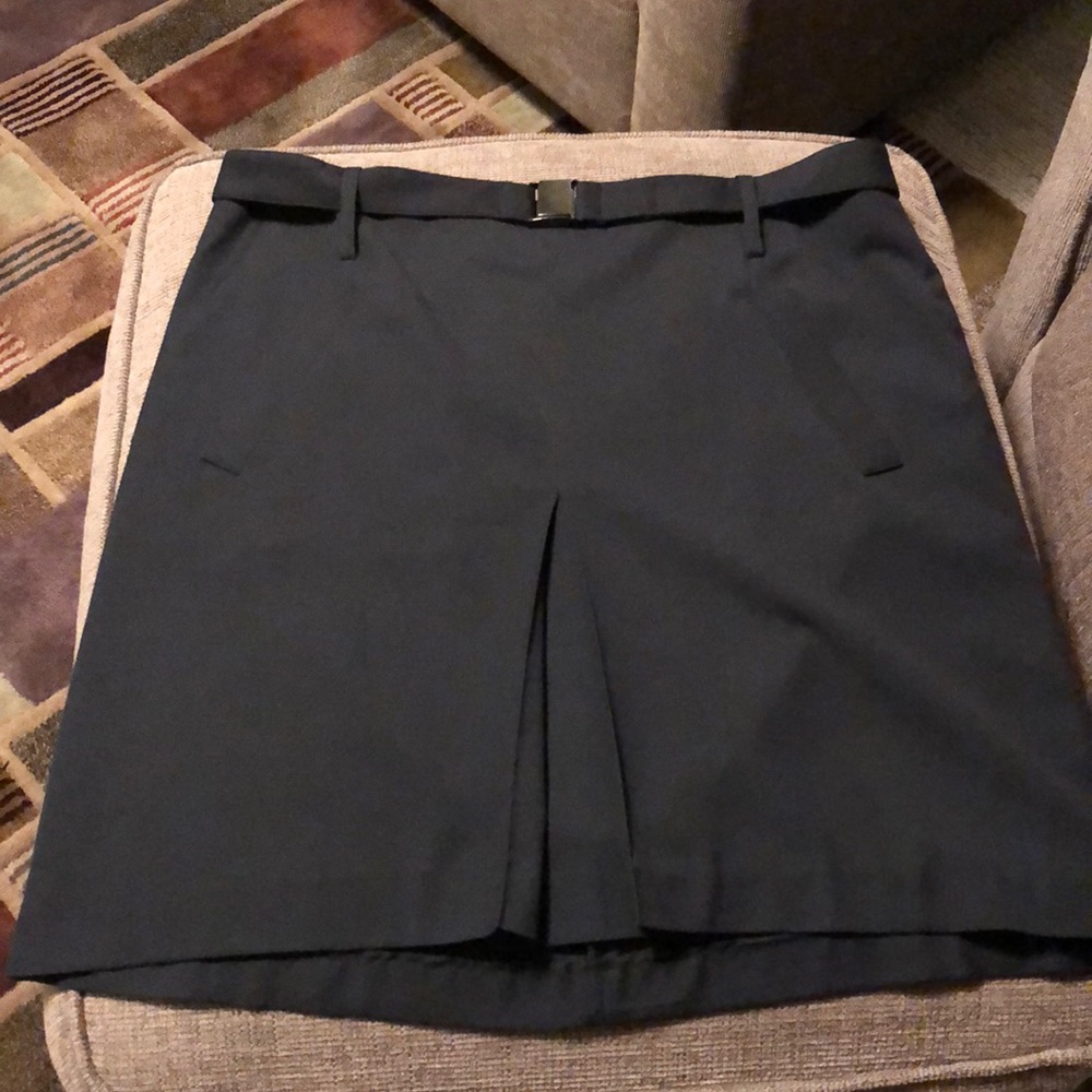 Navy blue, belted skirt with front pleat.